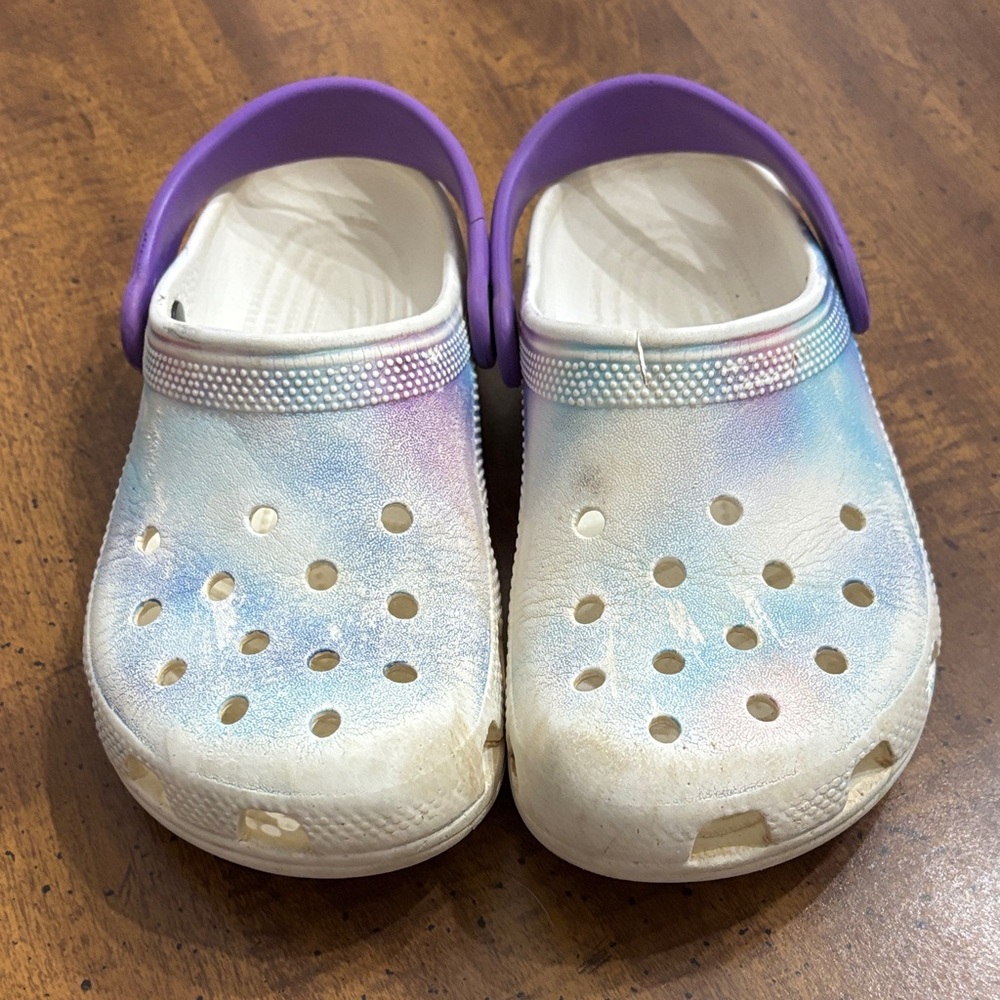 CROCS Kids Rainbow Crocs.  Has a small tear in the left croc. (See Pics)